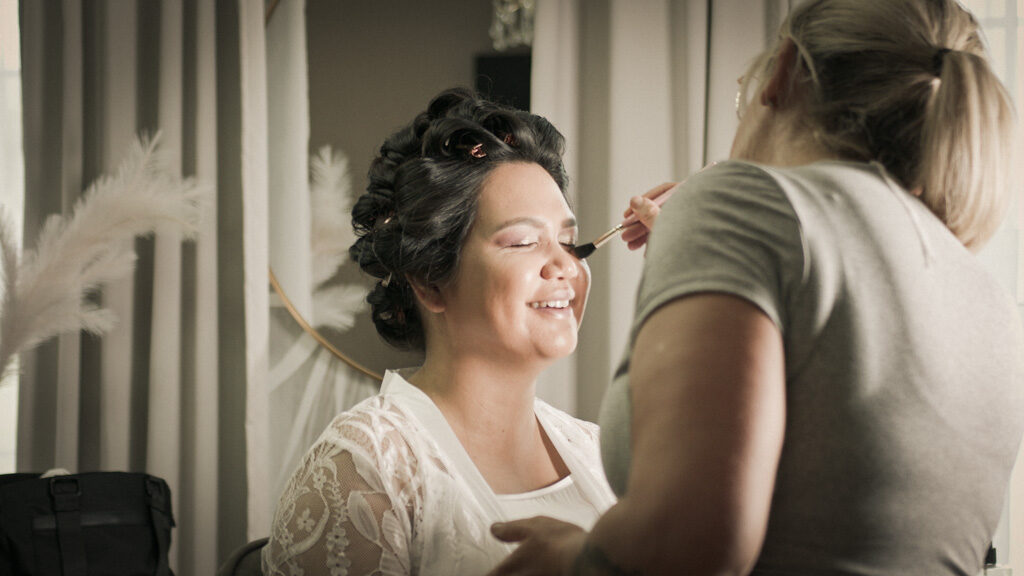 Bridal makeup during morning preparation filmed by a Northern Ireland wedding videographer